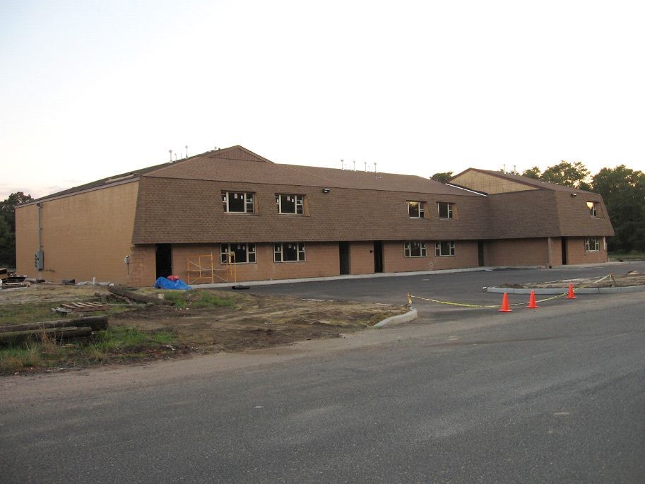 A large building with a lot of windows is being built