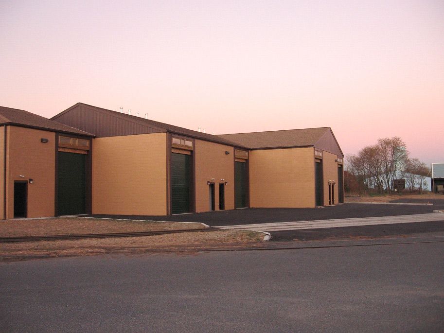 A row of buildings with a pink sky in the background