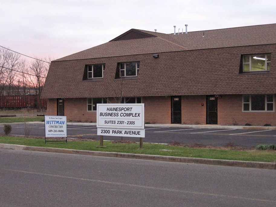 A brick building with a sign that says home port on it