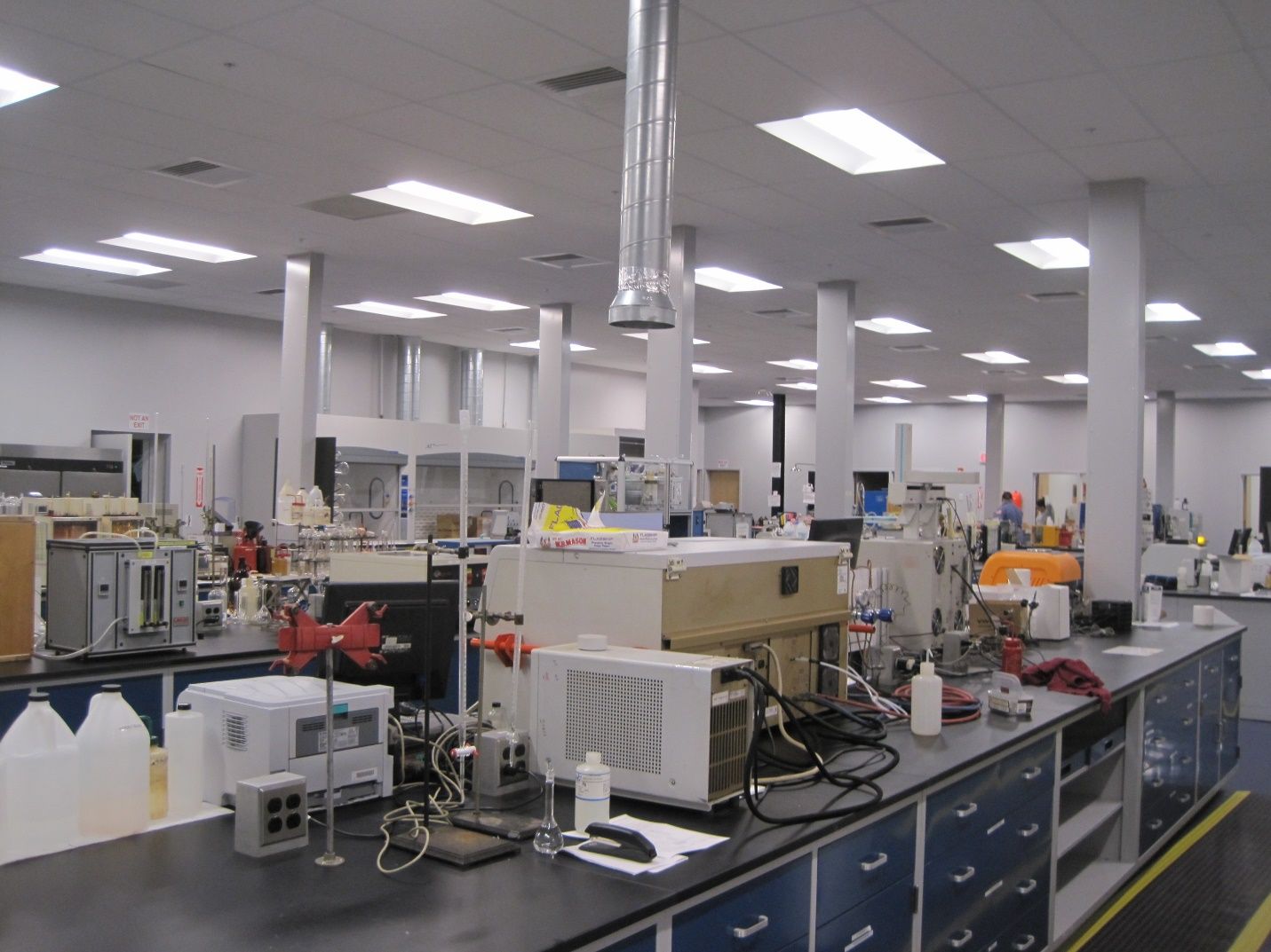 A laboratory with a lot of equipment including a microwave.