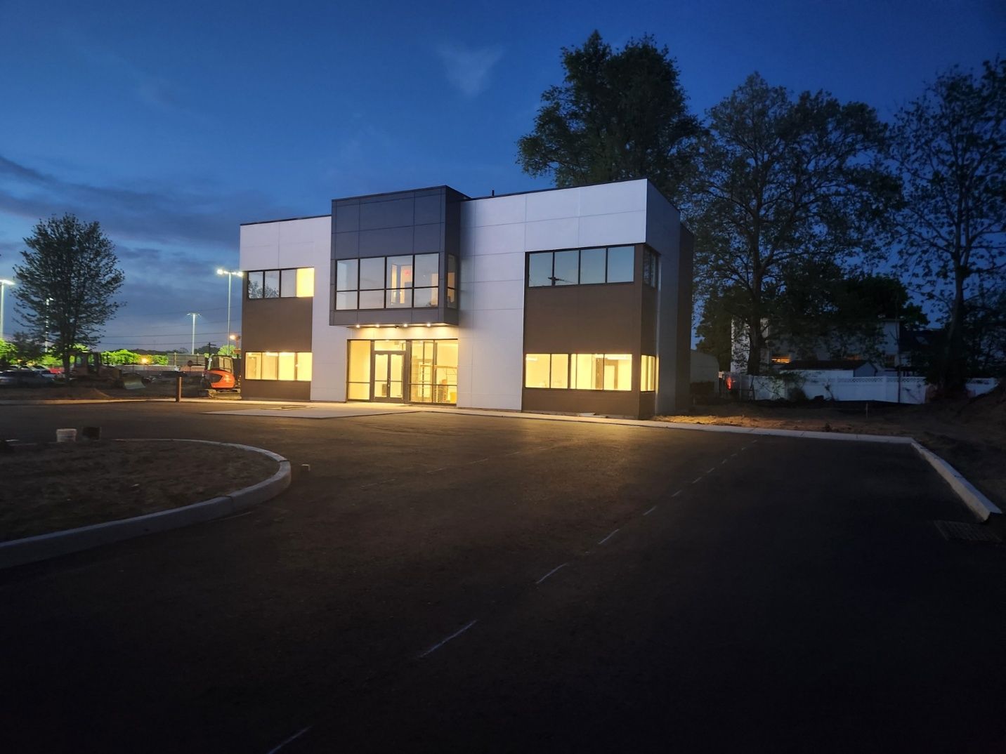 Modern office building at dusk.