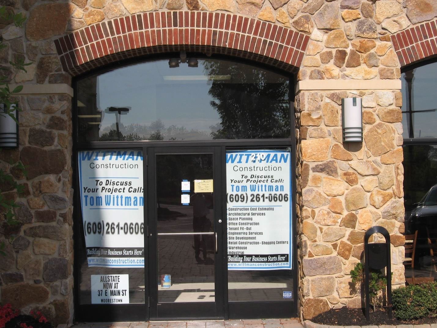 A building with a sign that says wittman construction