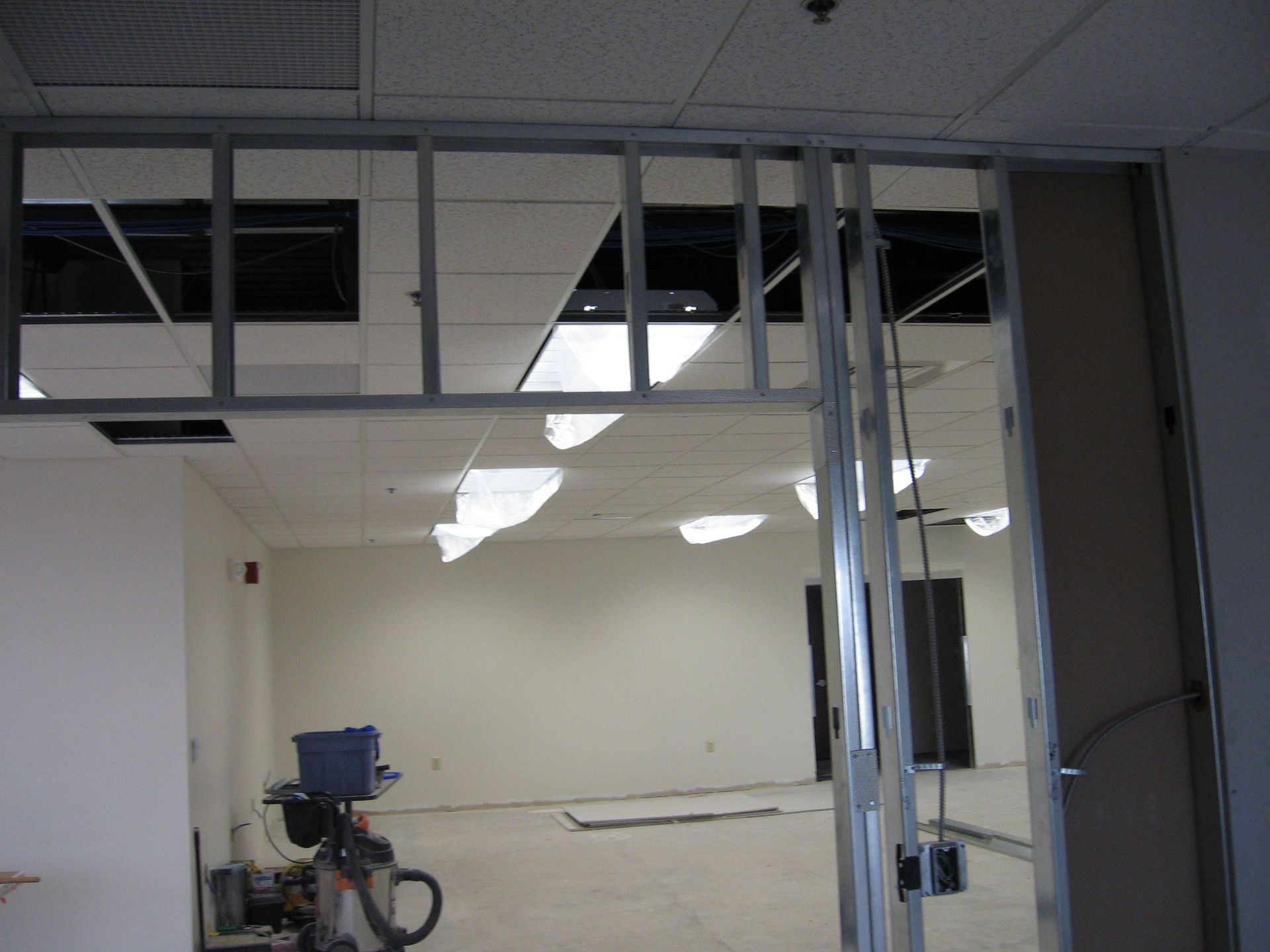 A room with a ceiling that has a hole in it