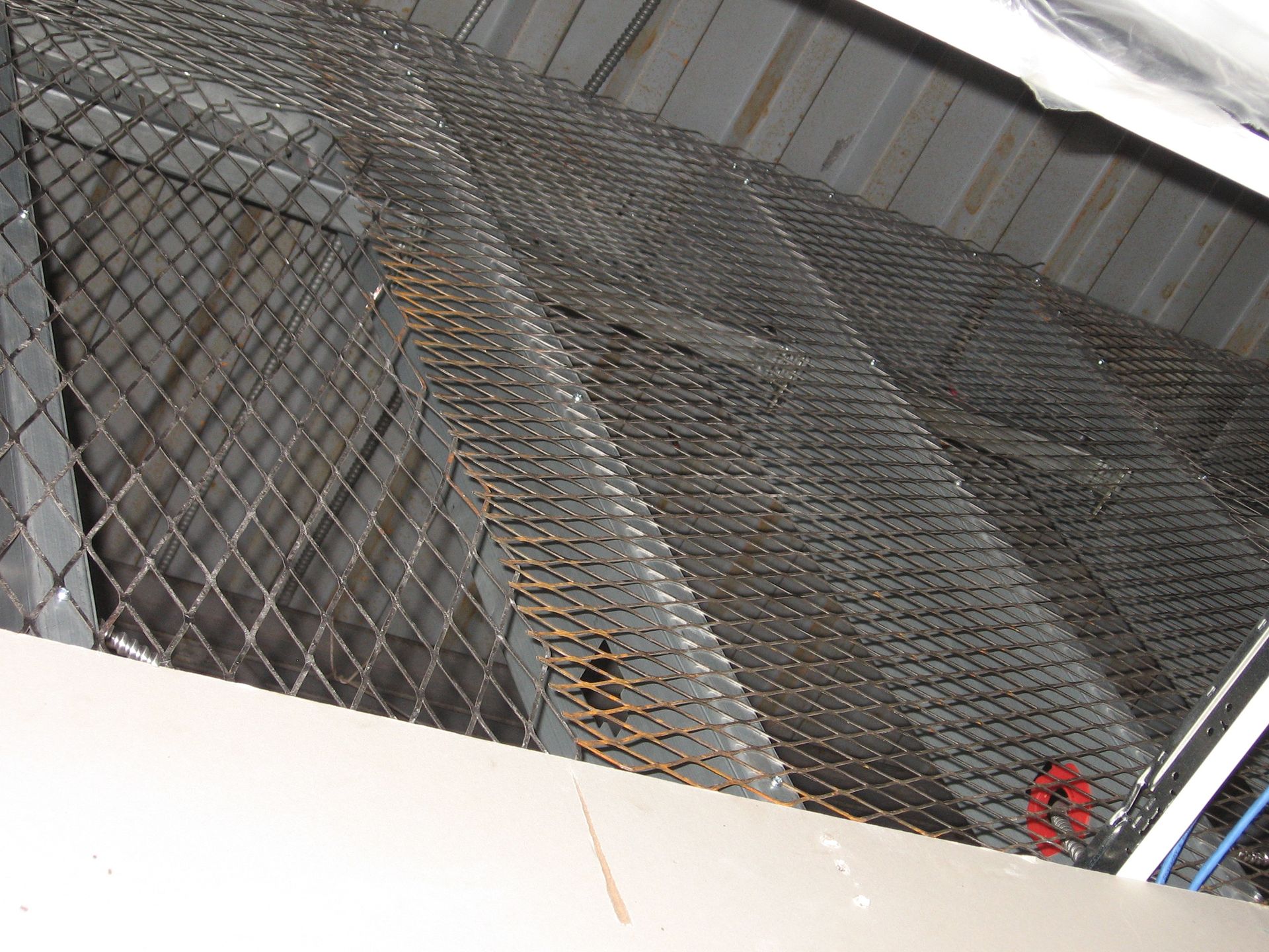 A close-up of a chain link fence in a building