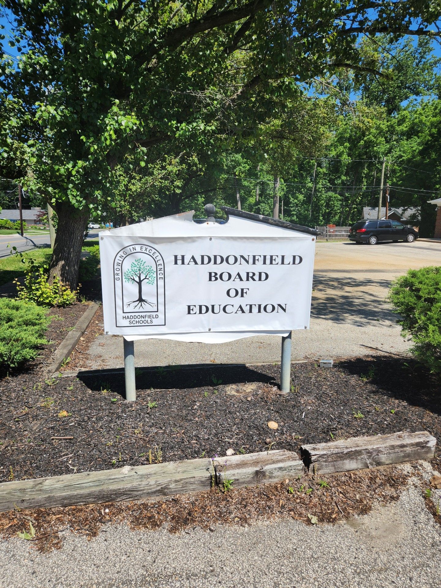 A sign that says Haddonfield board of education on it.