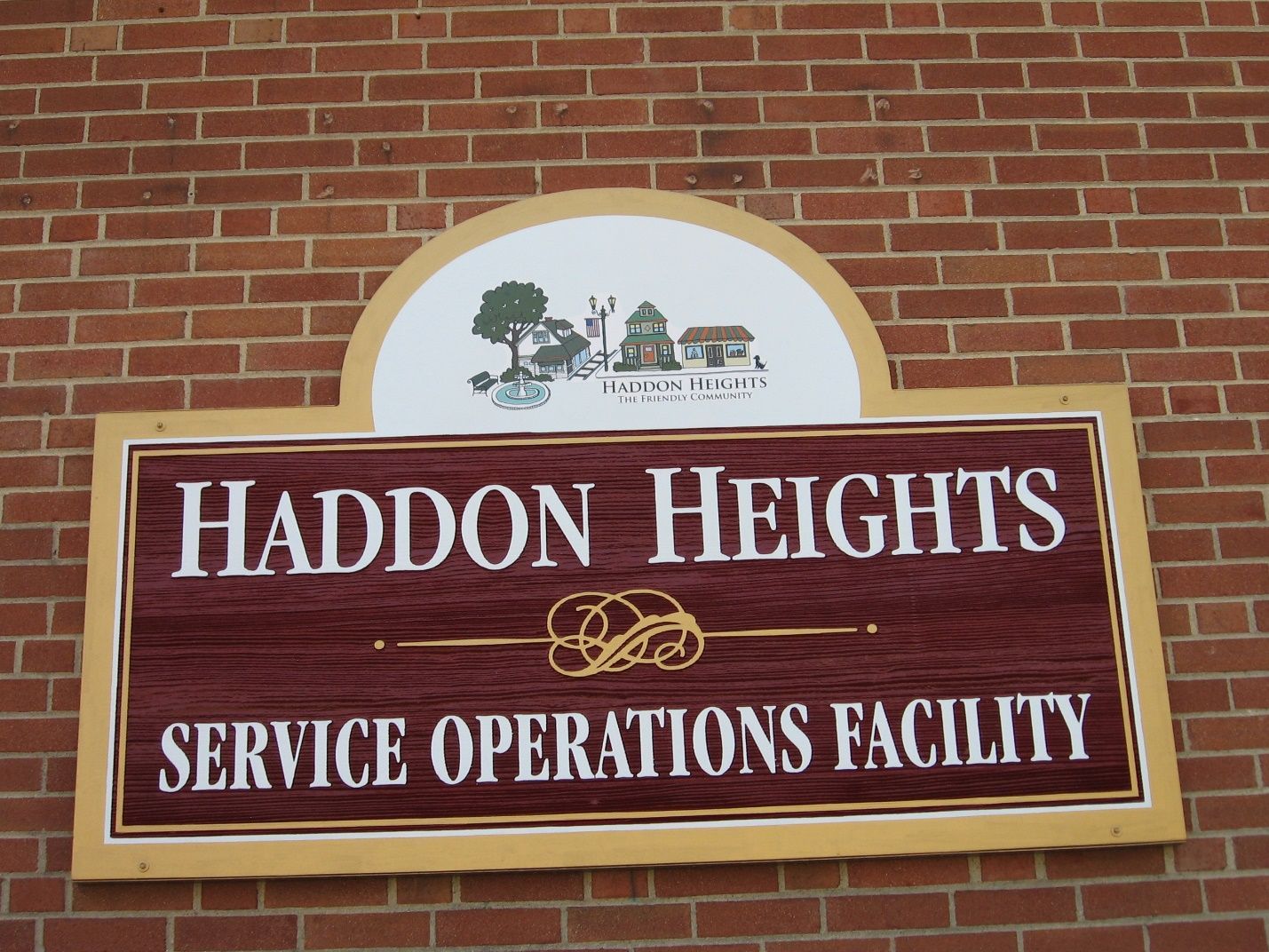 A sign on a brick wall says Haddon heights service operations' facility.