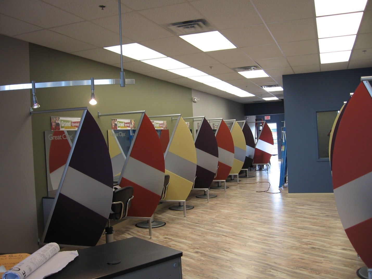 A row of colorful cubicles in a room.