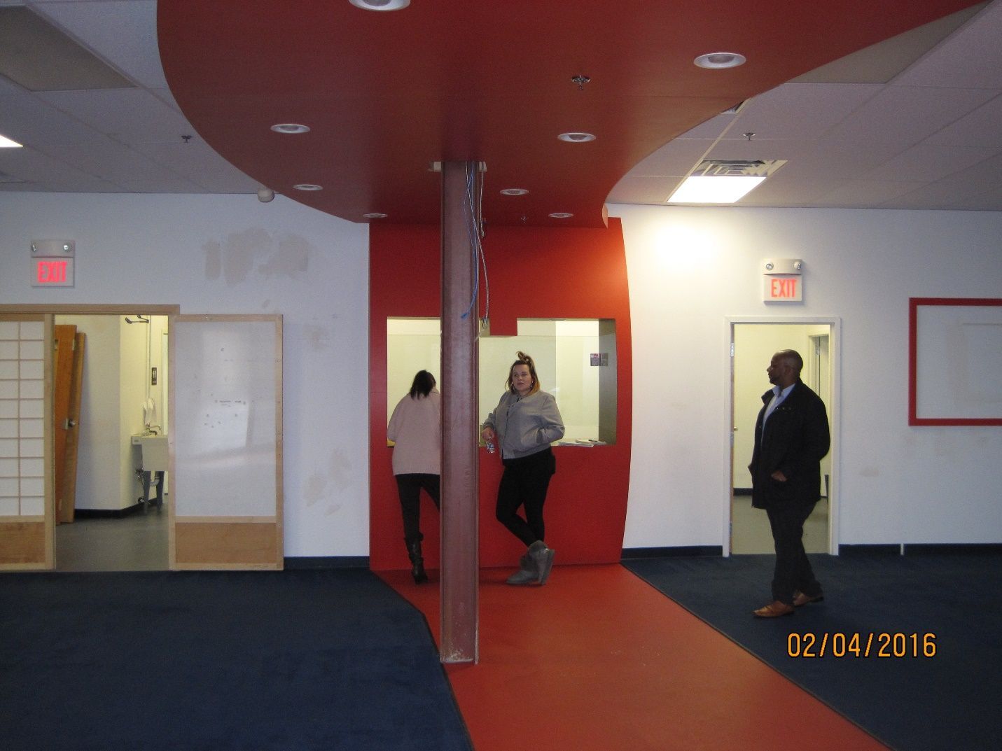 A photo taken on February 4th 2016 shows people standing in an empty room.