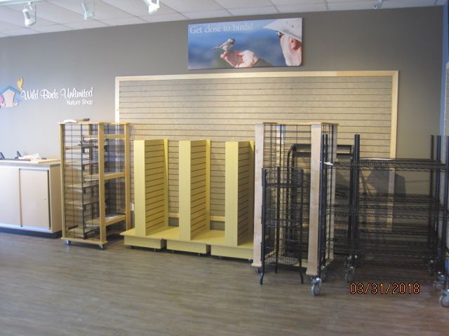 An empty store with a sign on the wall that says