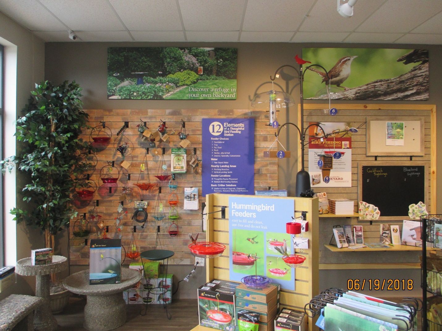 A store filled with lots of bird feeders and plants.