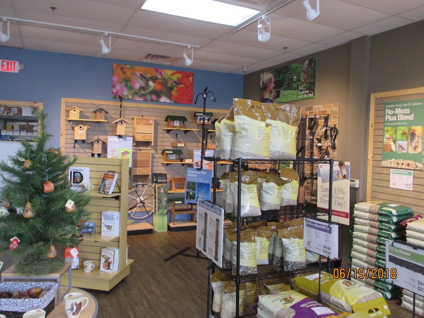 A store with a Christmas tree in the middle of it.