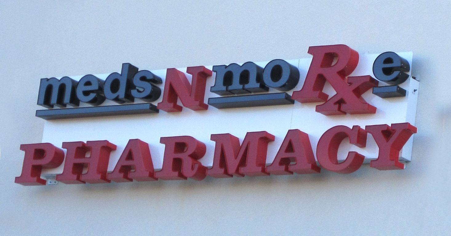 A picture showing the Meds N More Pharmacy logo