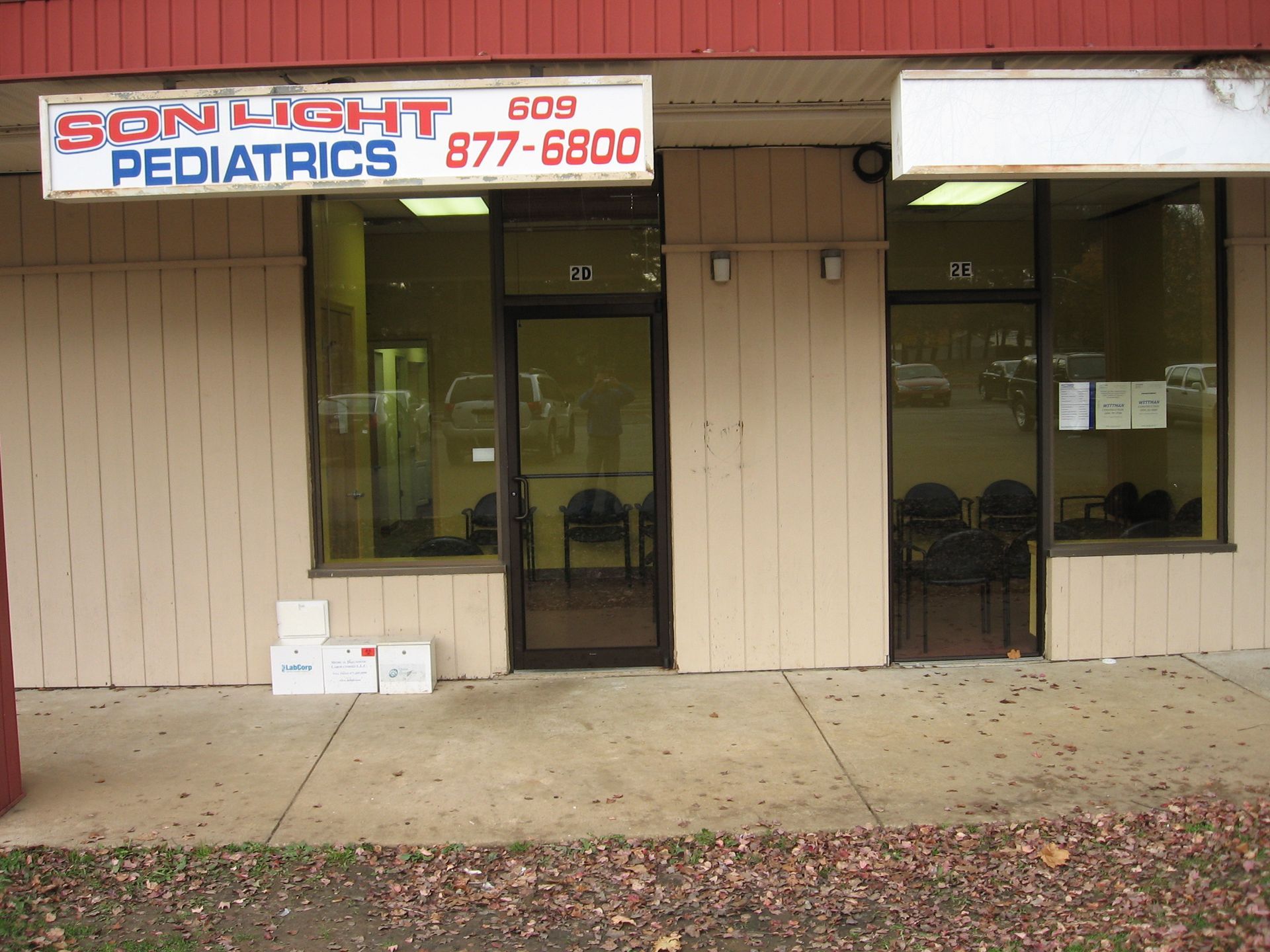 A building with a sign that says Son Light Pediatrics