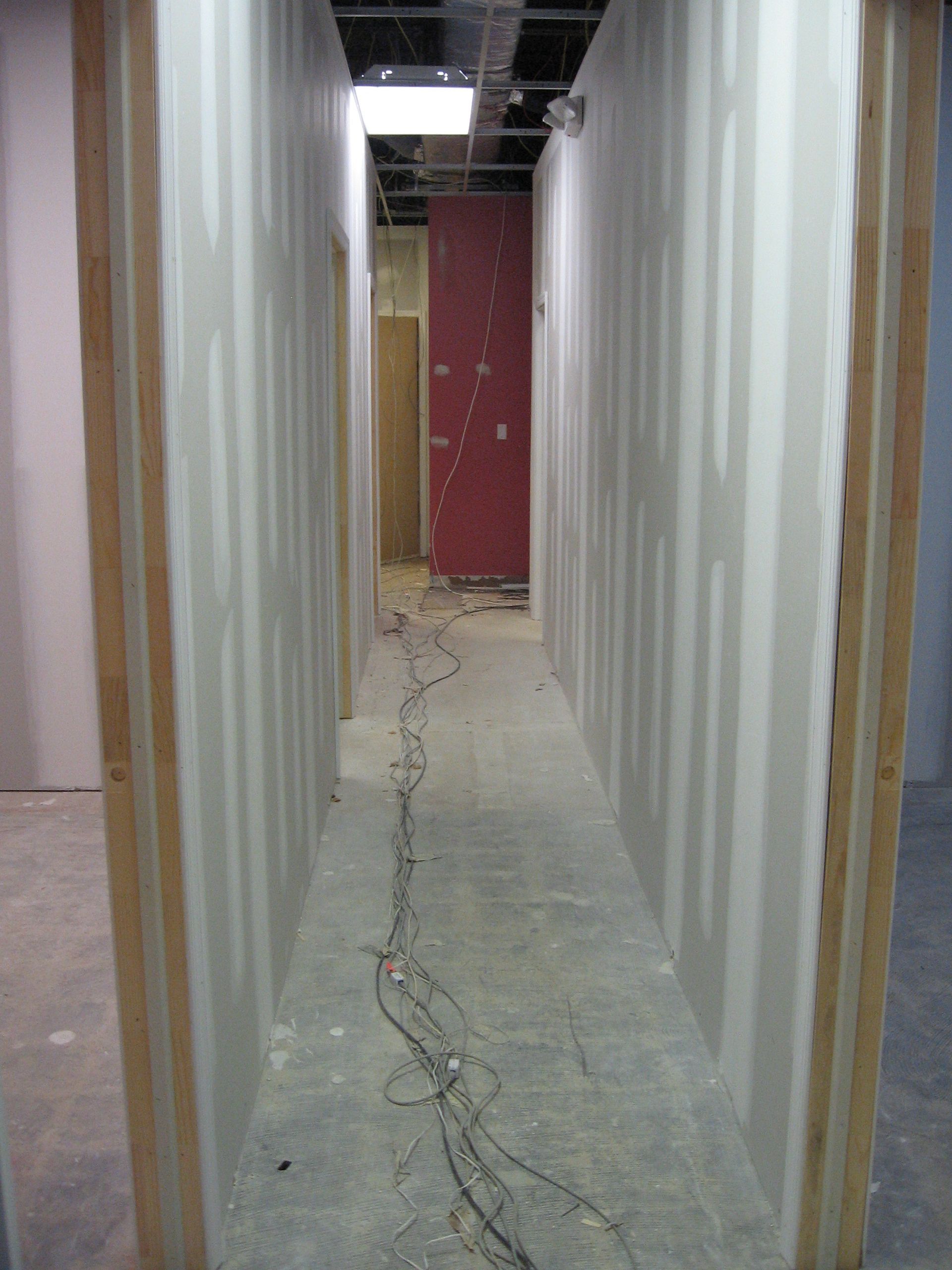A long hallway in a building under construction