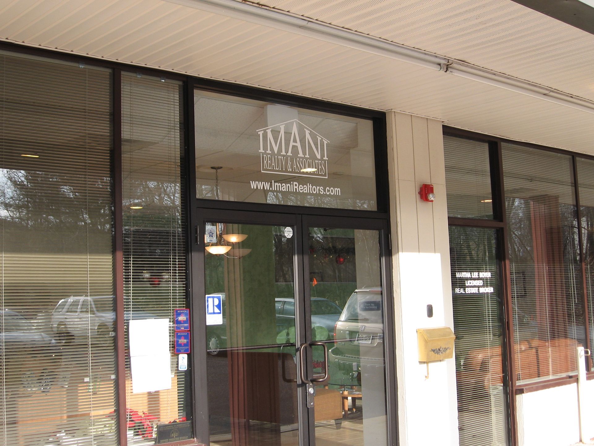 A building with a sign that says Imani on it