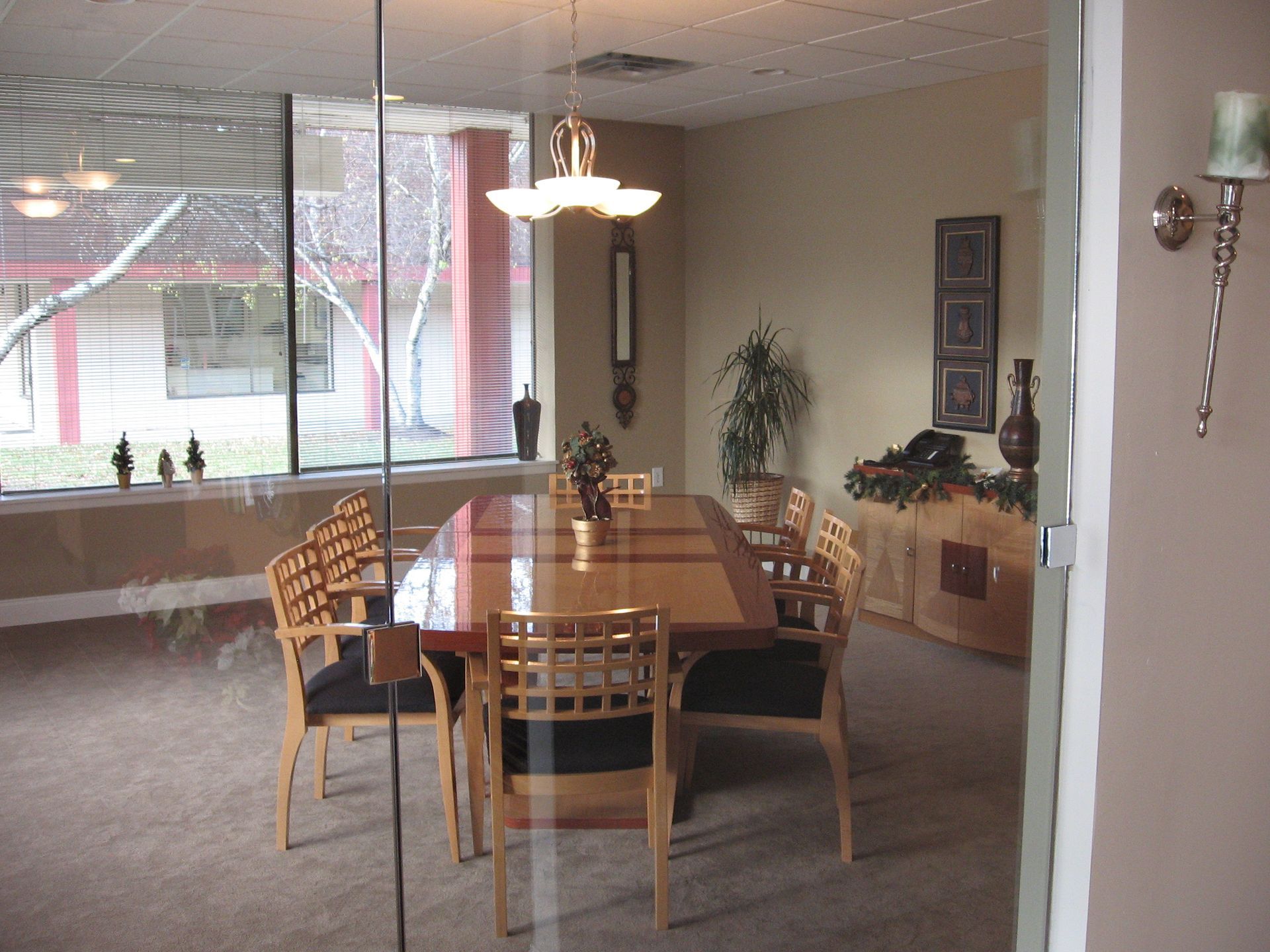 A dining room with a long table and chairs