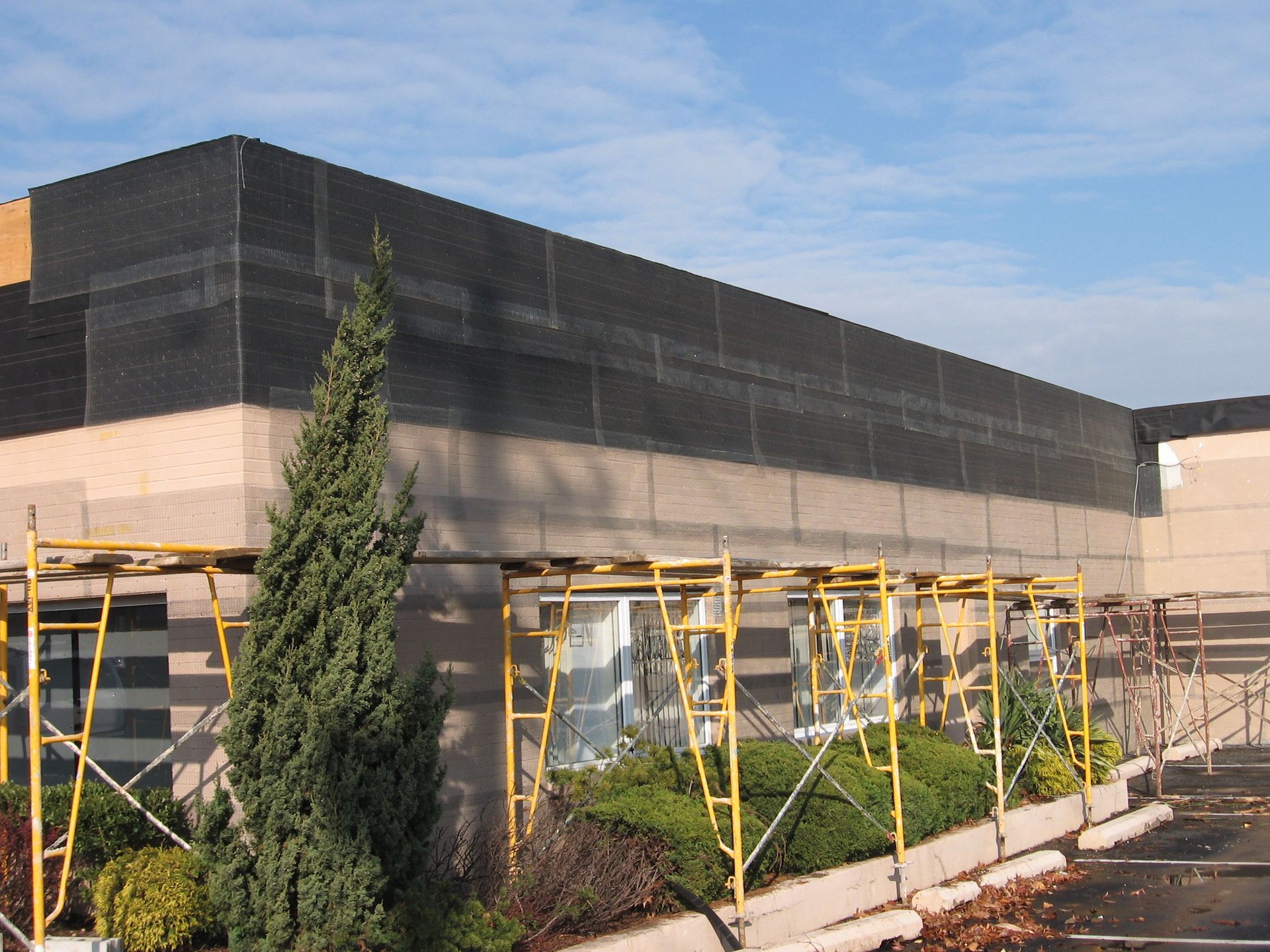 A building under construction with scaffolding around it