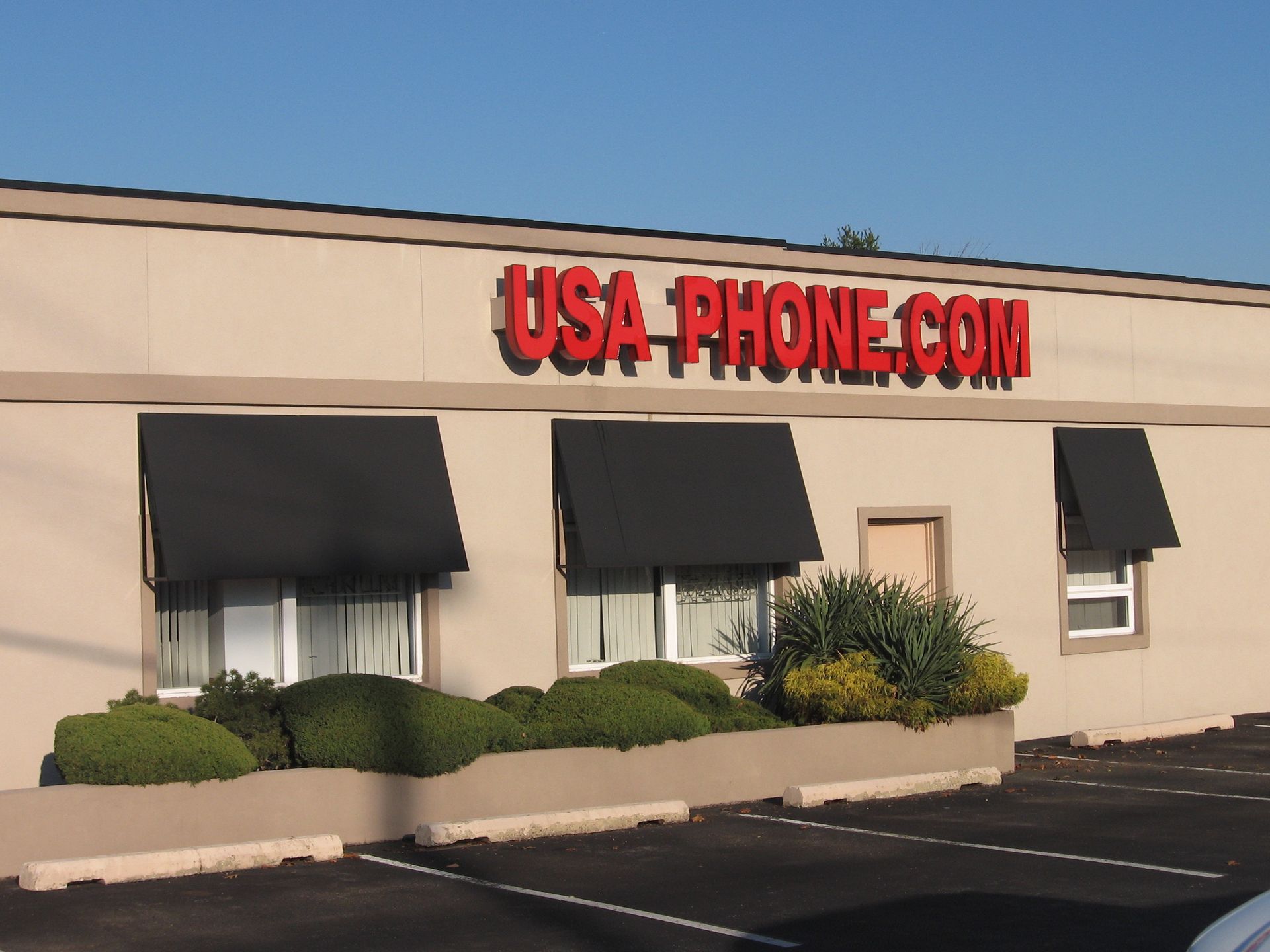 A building with a sign that says USA PHONE.COM