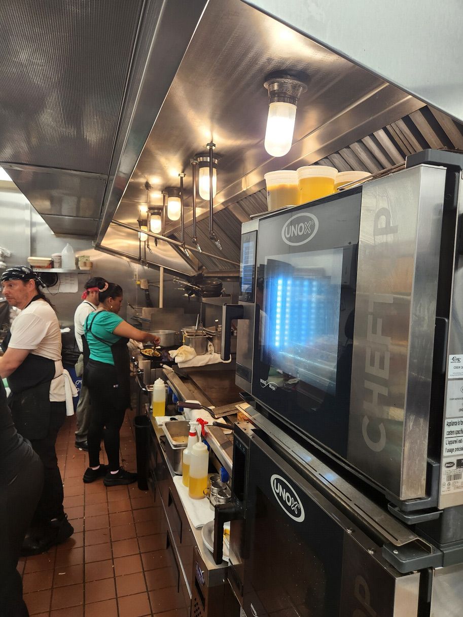 A kitchen with a microwave that says chef on it