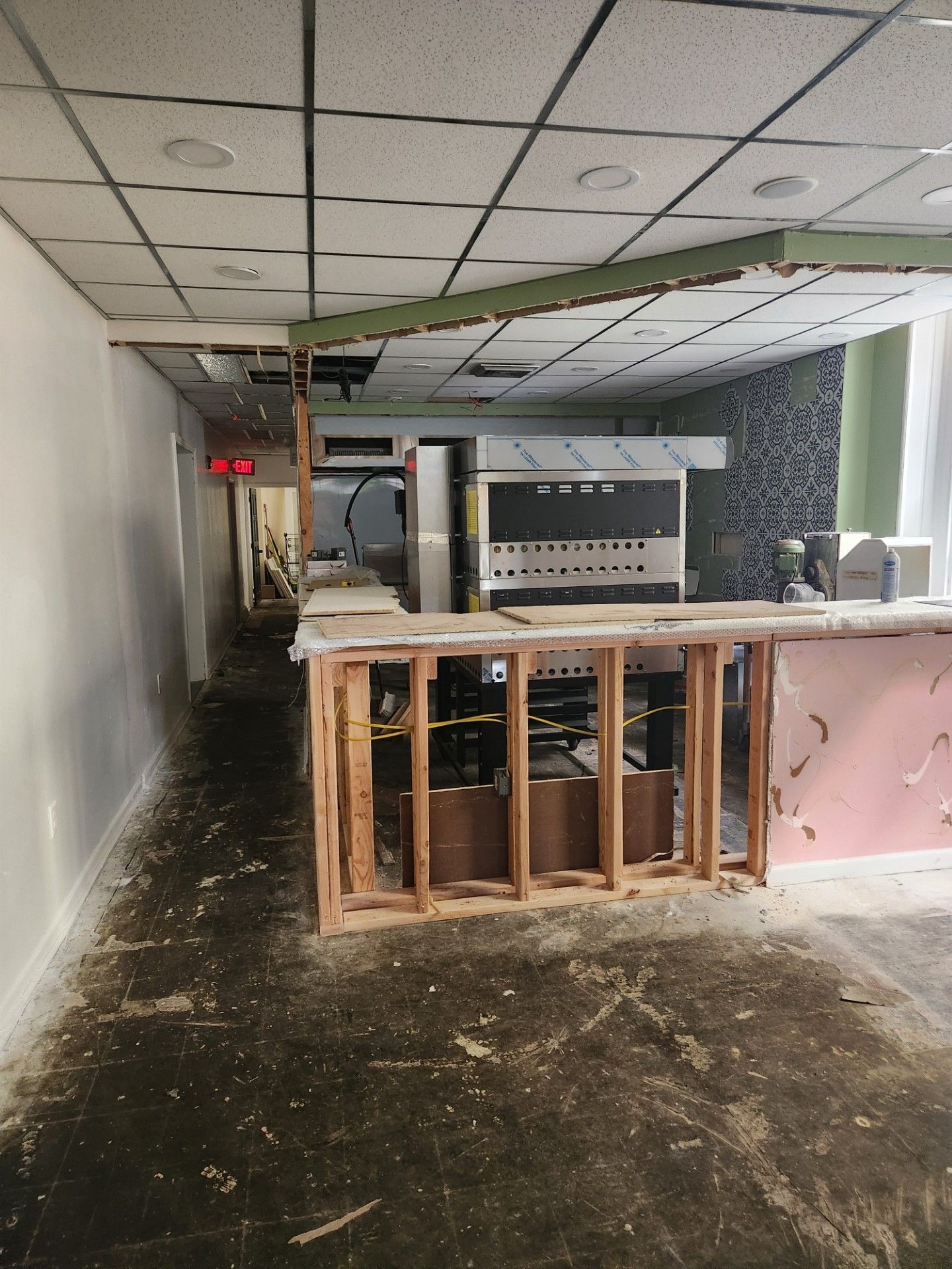 An empty room with a ceiling that has a hole in it