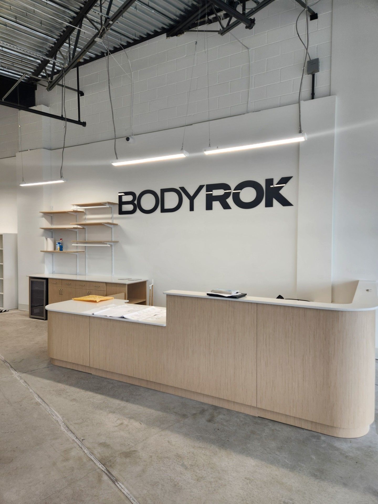 A reception area with a sign that says Bodyrok on it