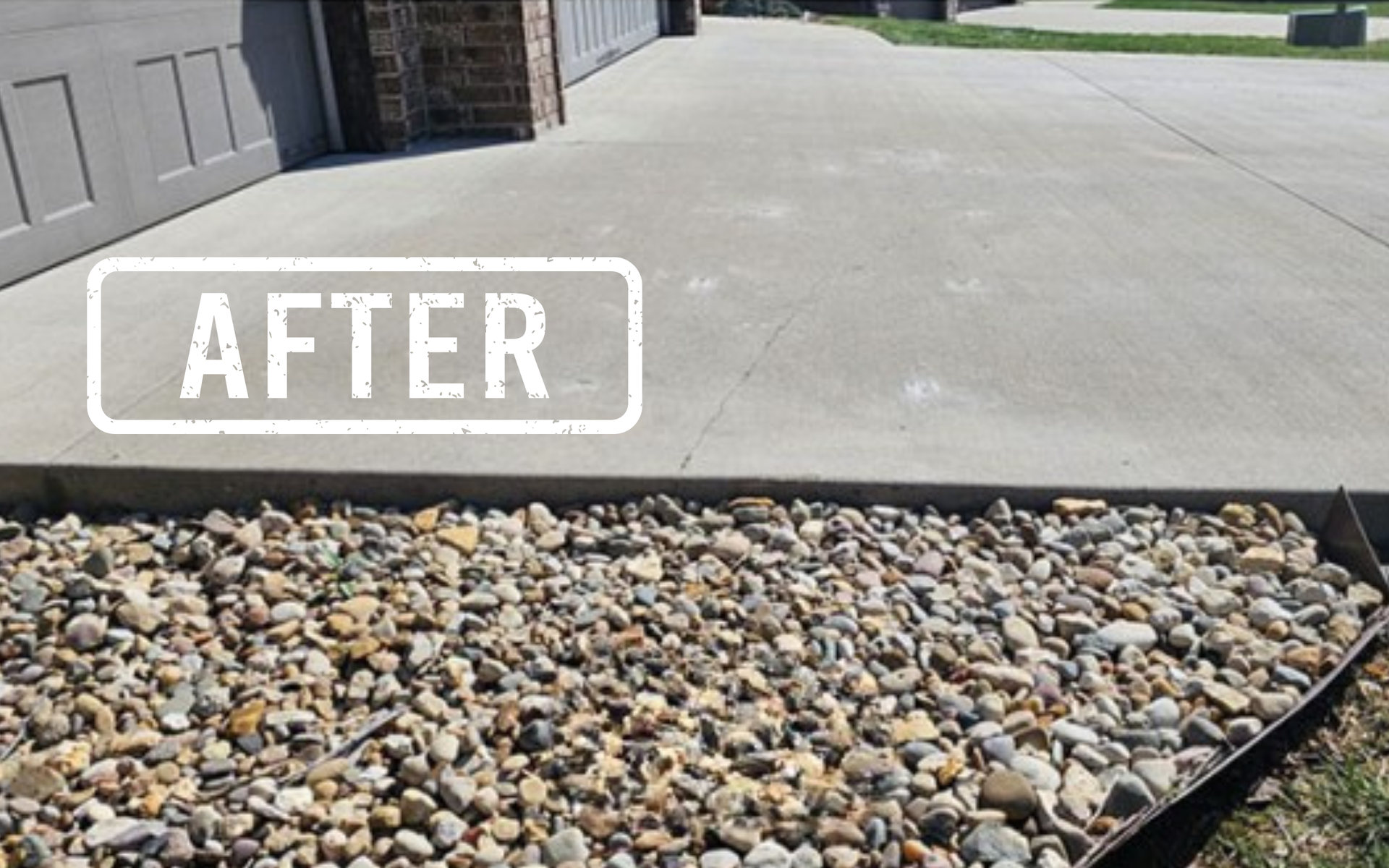 Concrete driveway edge beside a pebble bed