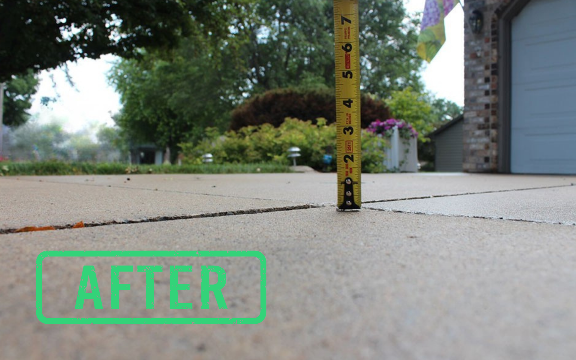 Concrete sidewalk beside a garage