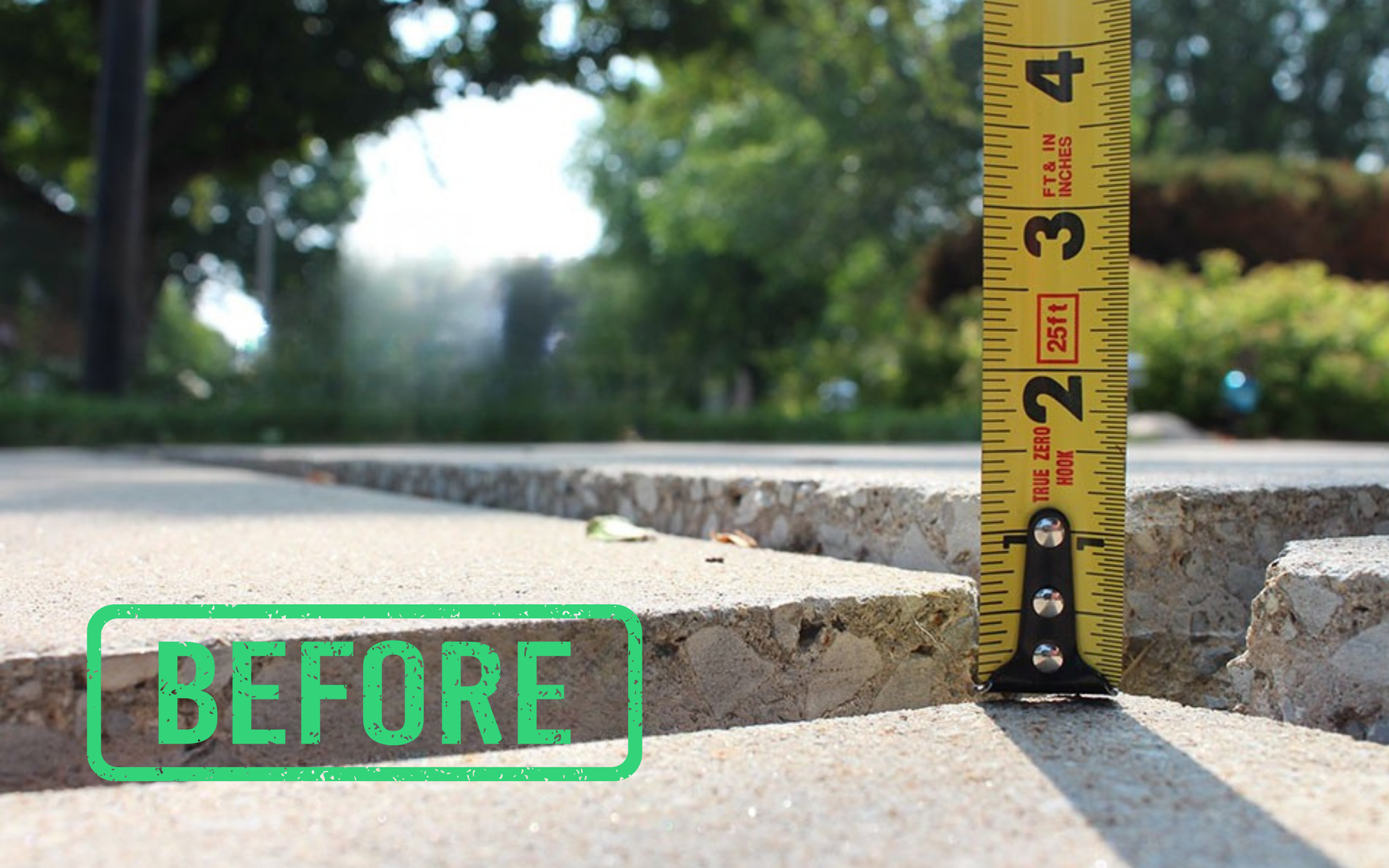 Cracked sidewalk curb with a measuring tape showing height