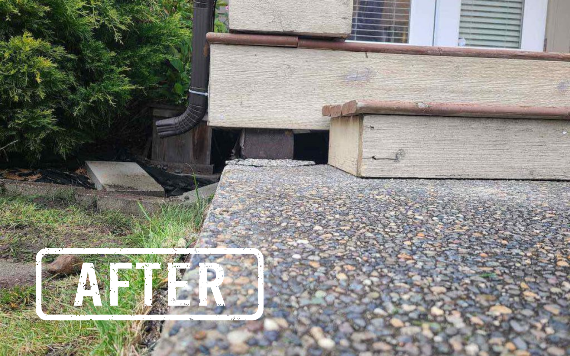 Gravel piled against a house foundation with exposed siding
