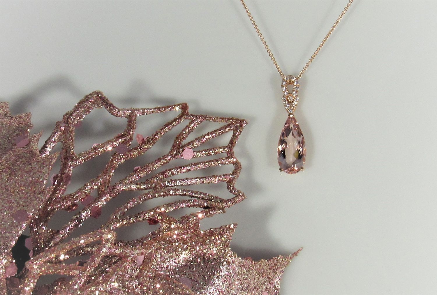 A close up of a necklace and a flower