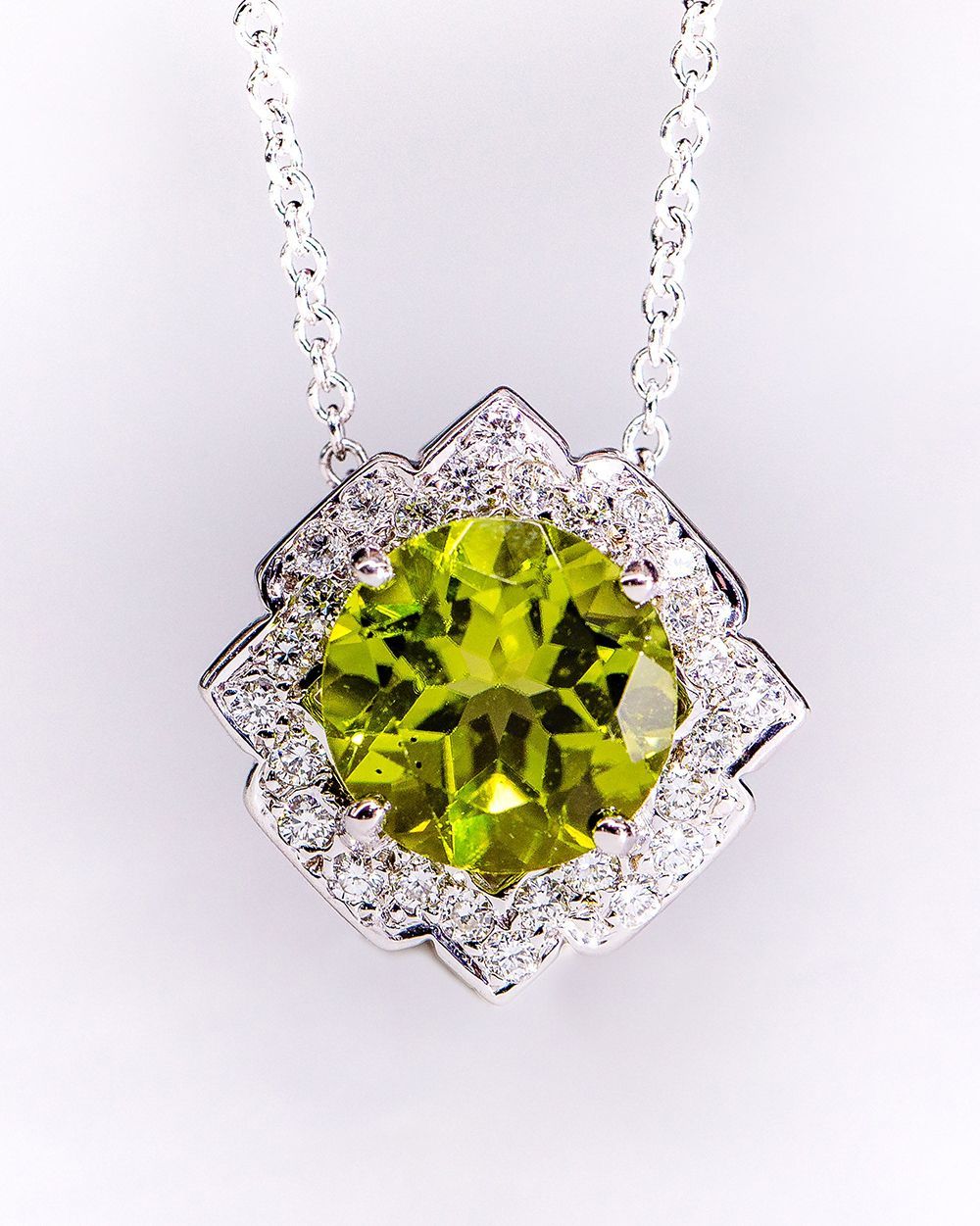 A necklace with a green stone in the center