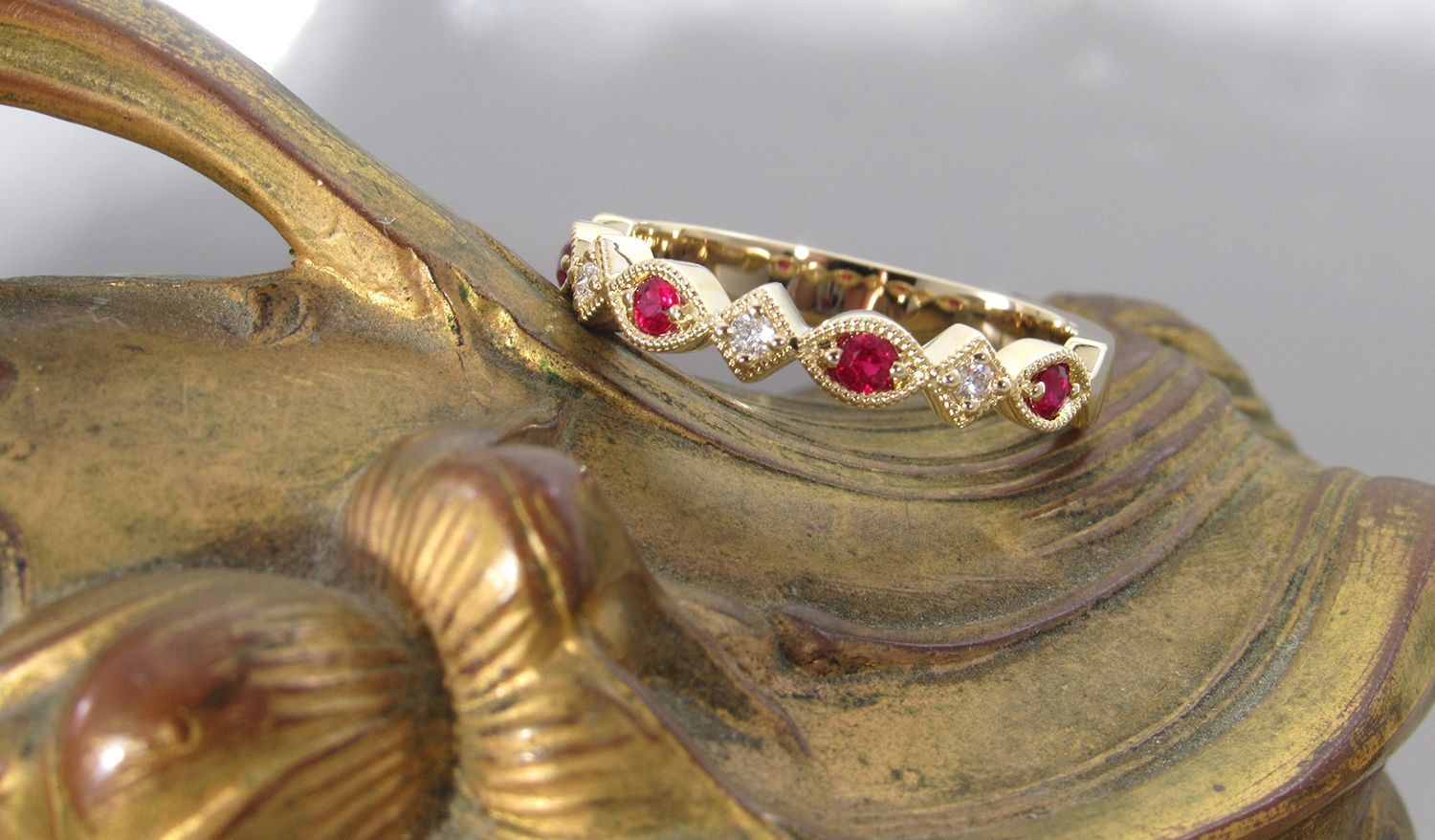 A gold ring with rubies and diamonds