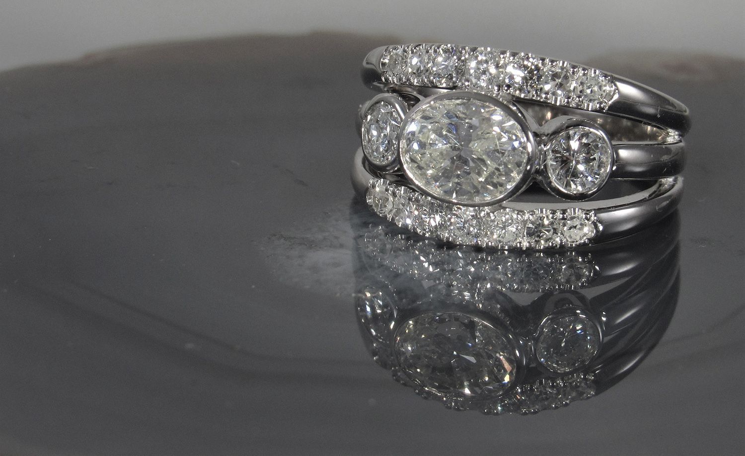 A close up of a diamond ring on a table