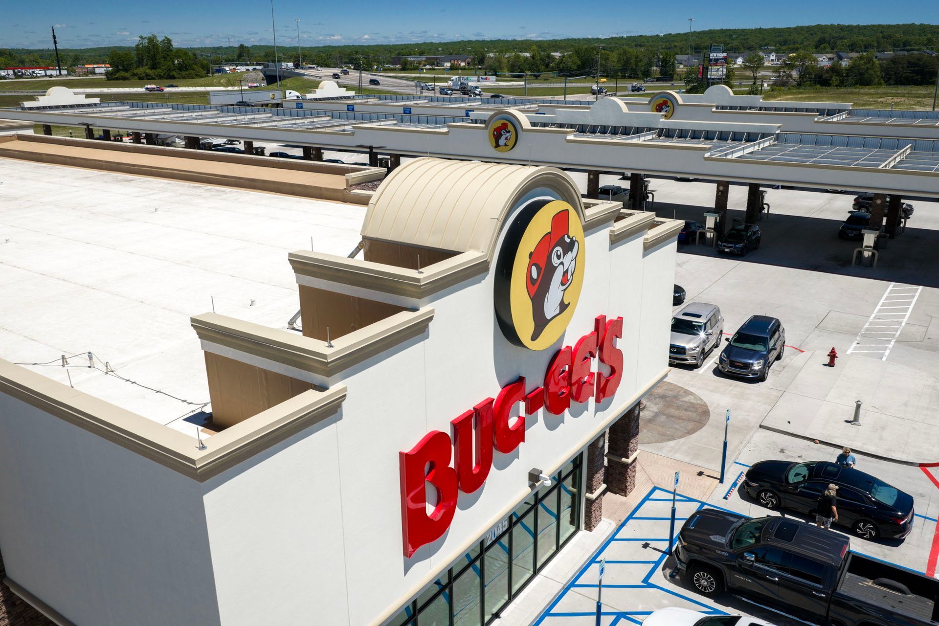 Buc-ee's store exterior with large beaver logo and parking lot on a sunny day