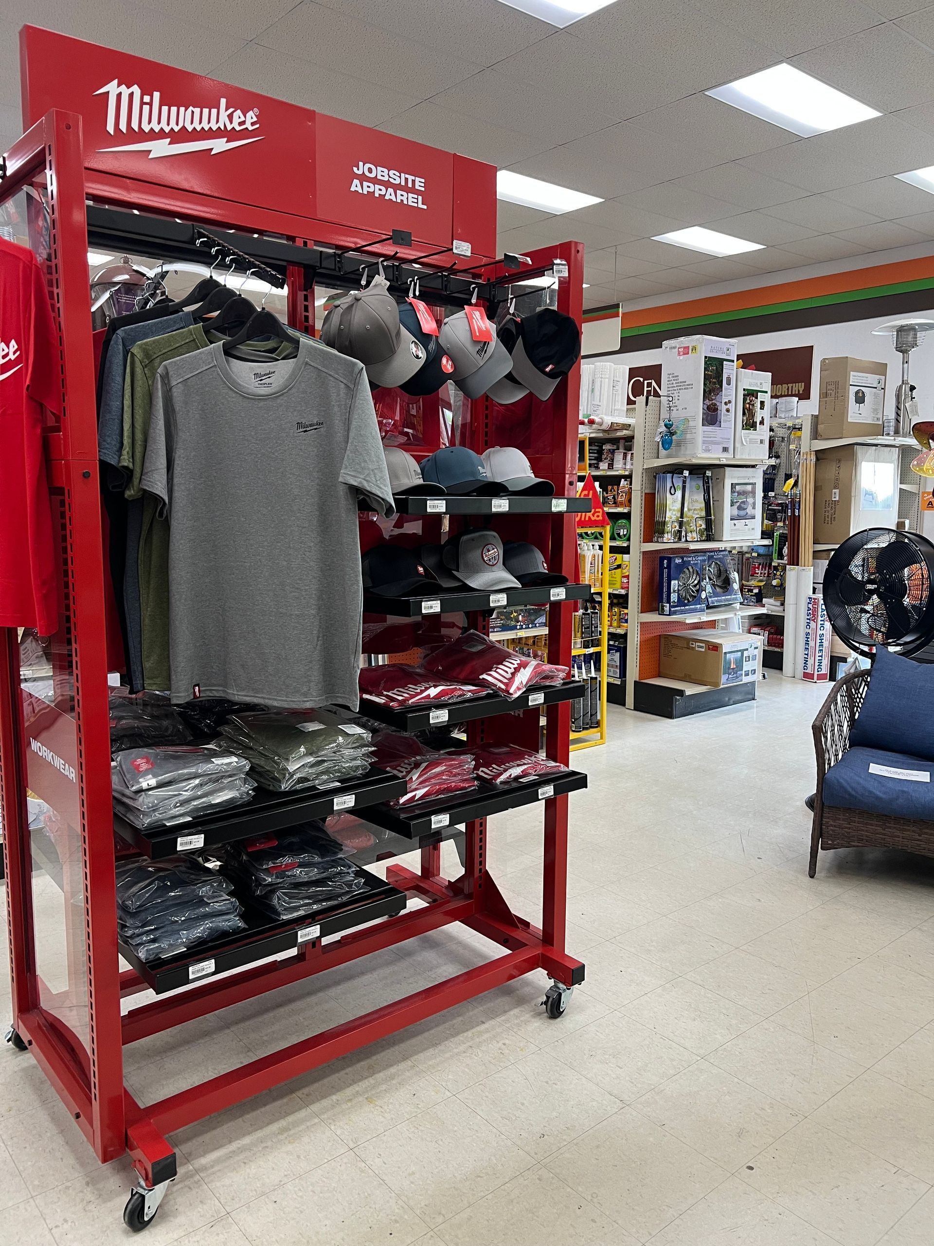 A display of shirts and hats in a store.