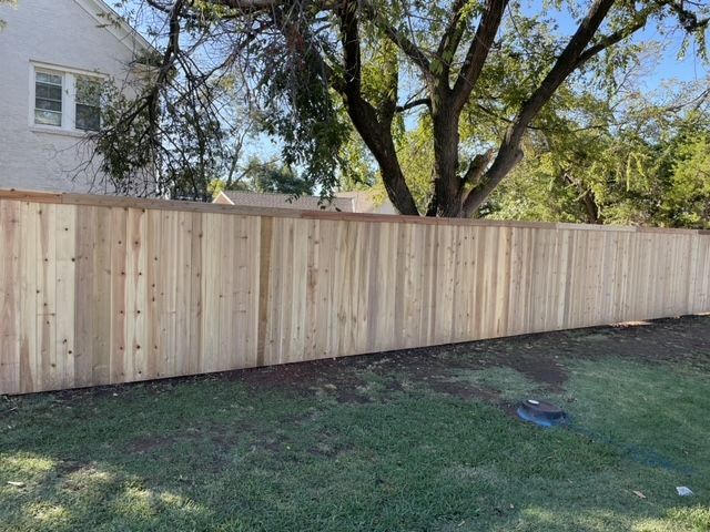 Residential wood fence installation side view