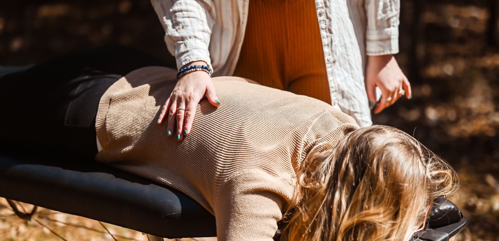 A woman is lying on a chiropractic table.