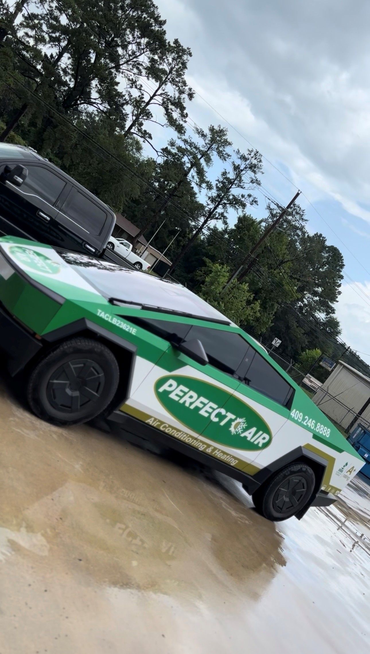 A Tesla Cybertruck with a white and green 