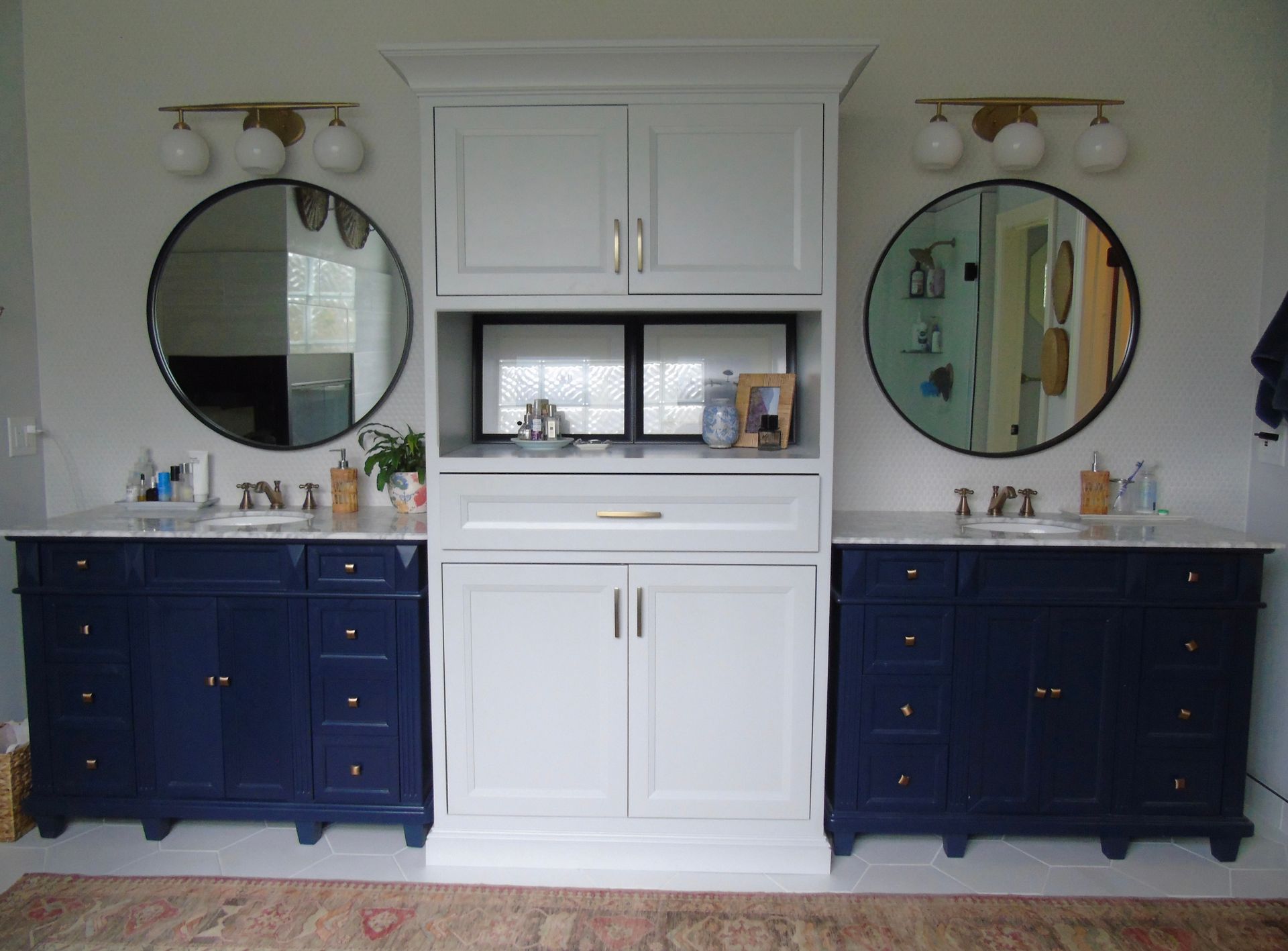 A bathroom with two sinks and two mirrors.