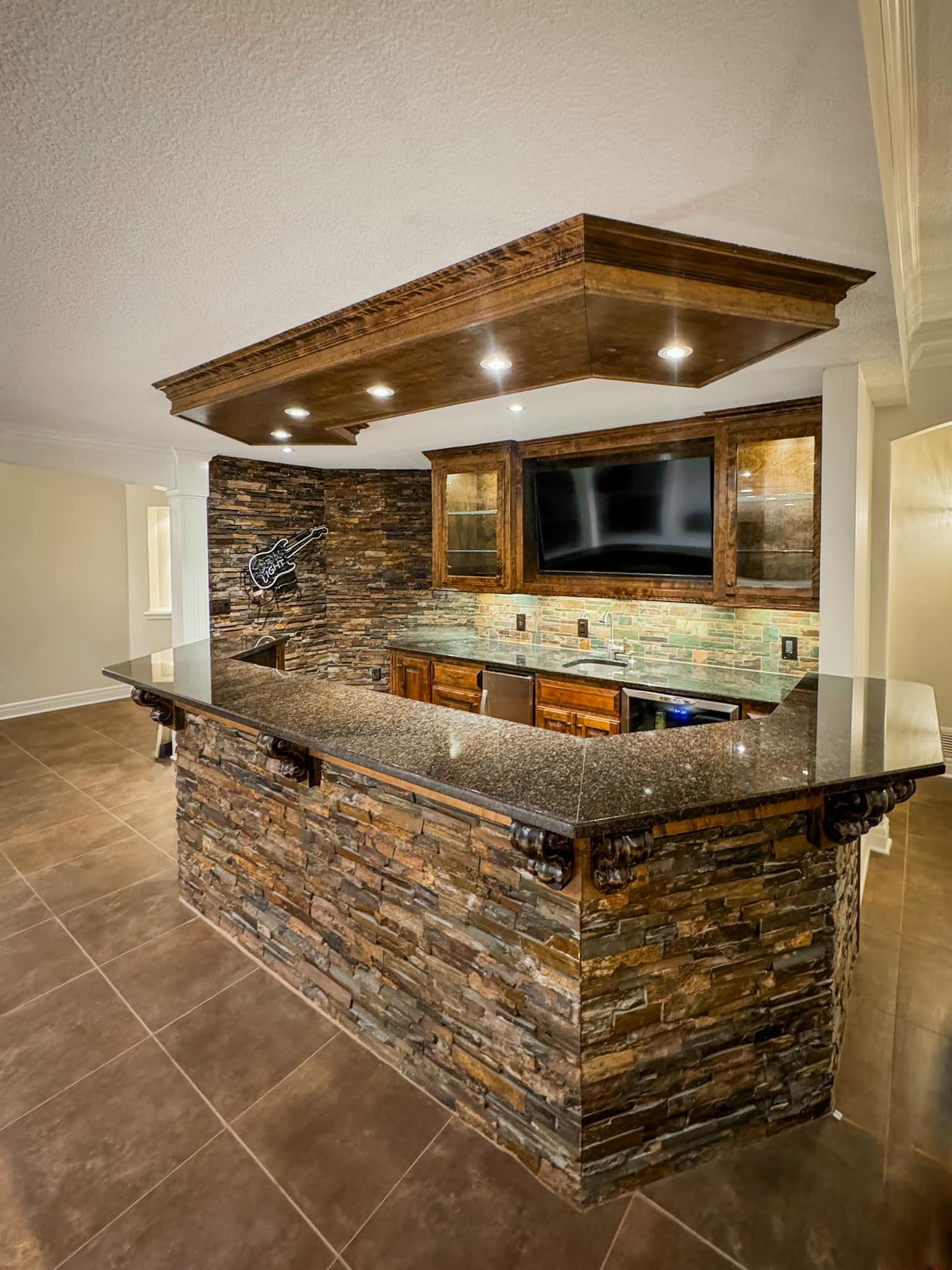 There is a large stone bar in the middle of the room.