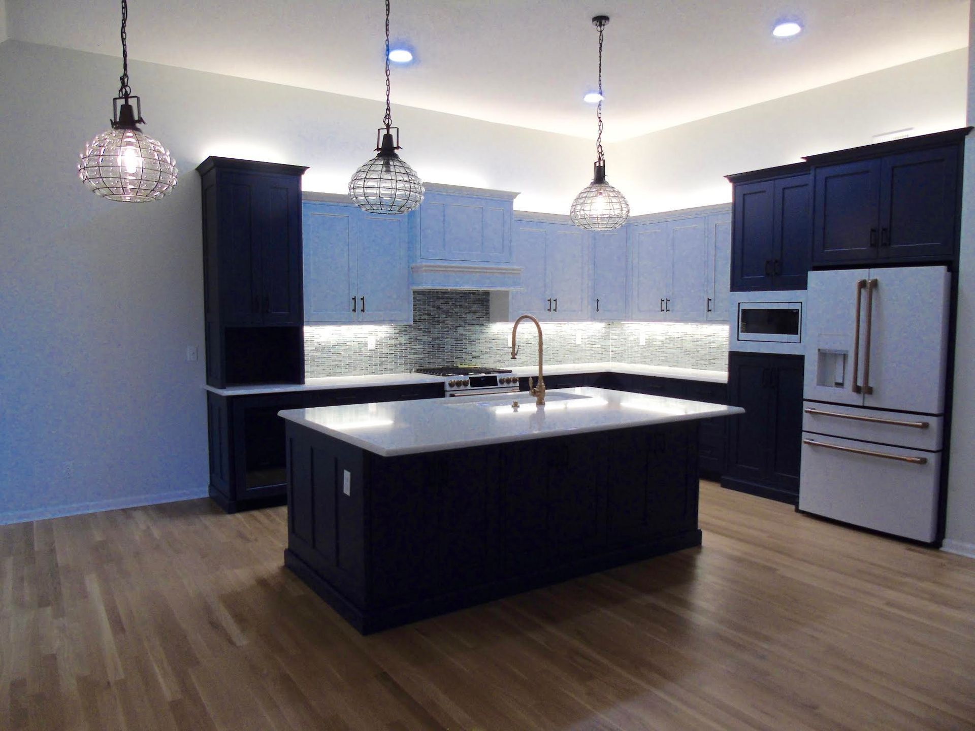 Modern kitchen with navy and white cabinets