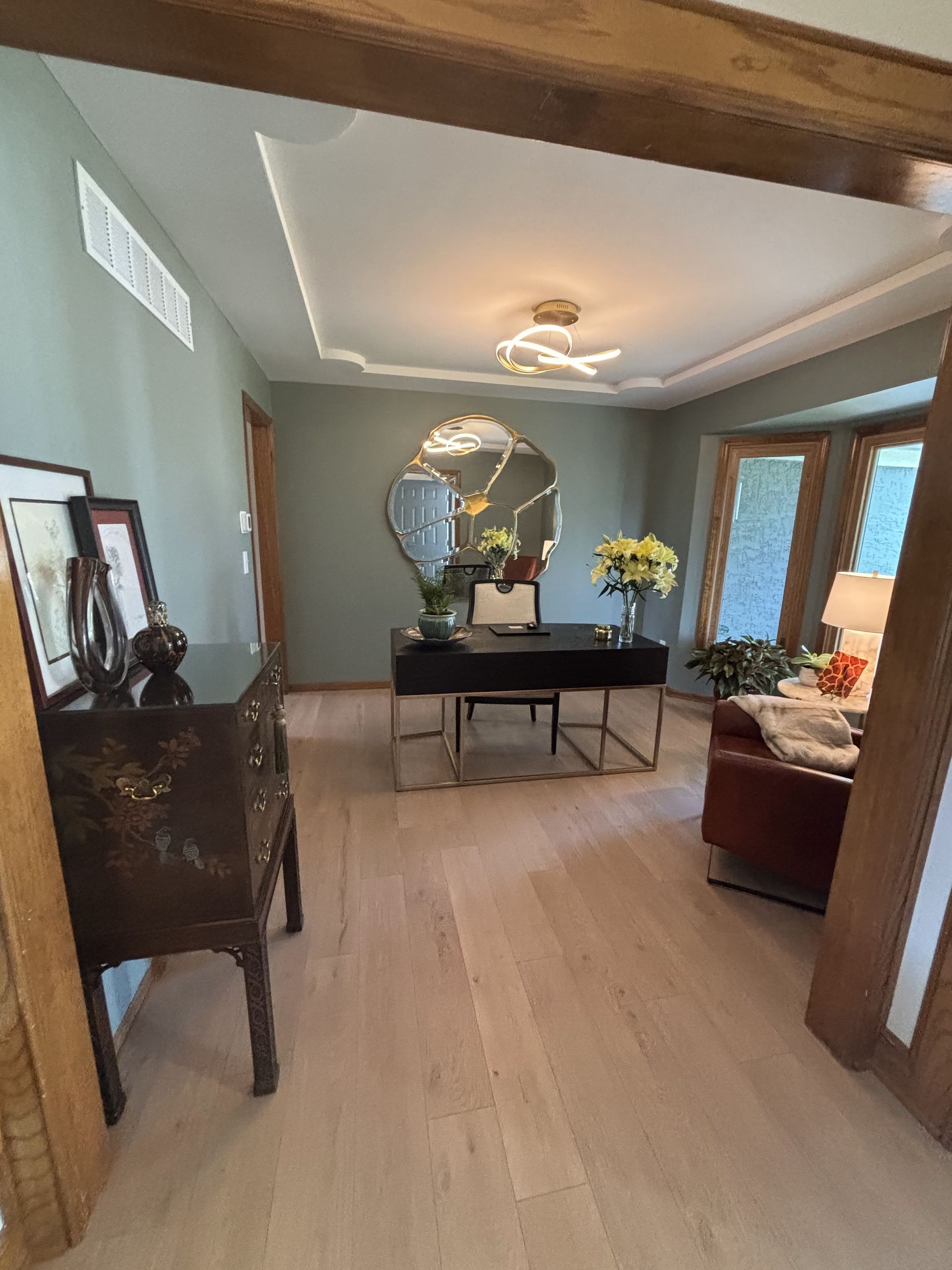 There is a desk in the middle of the room.