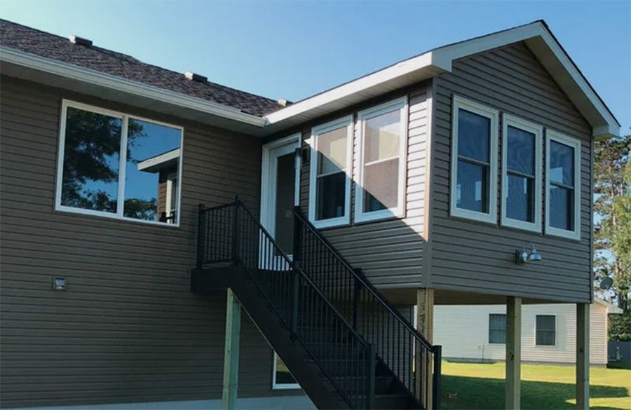 A house with a staircase leading up to it