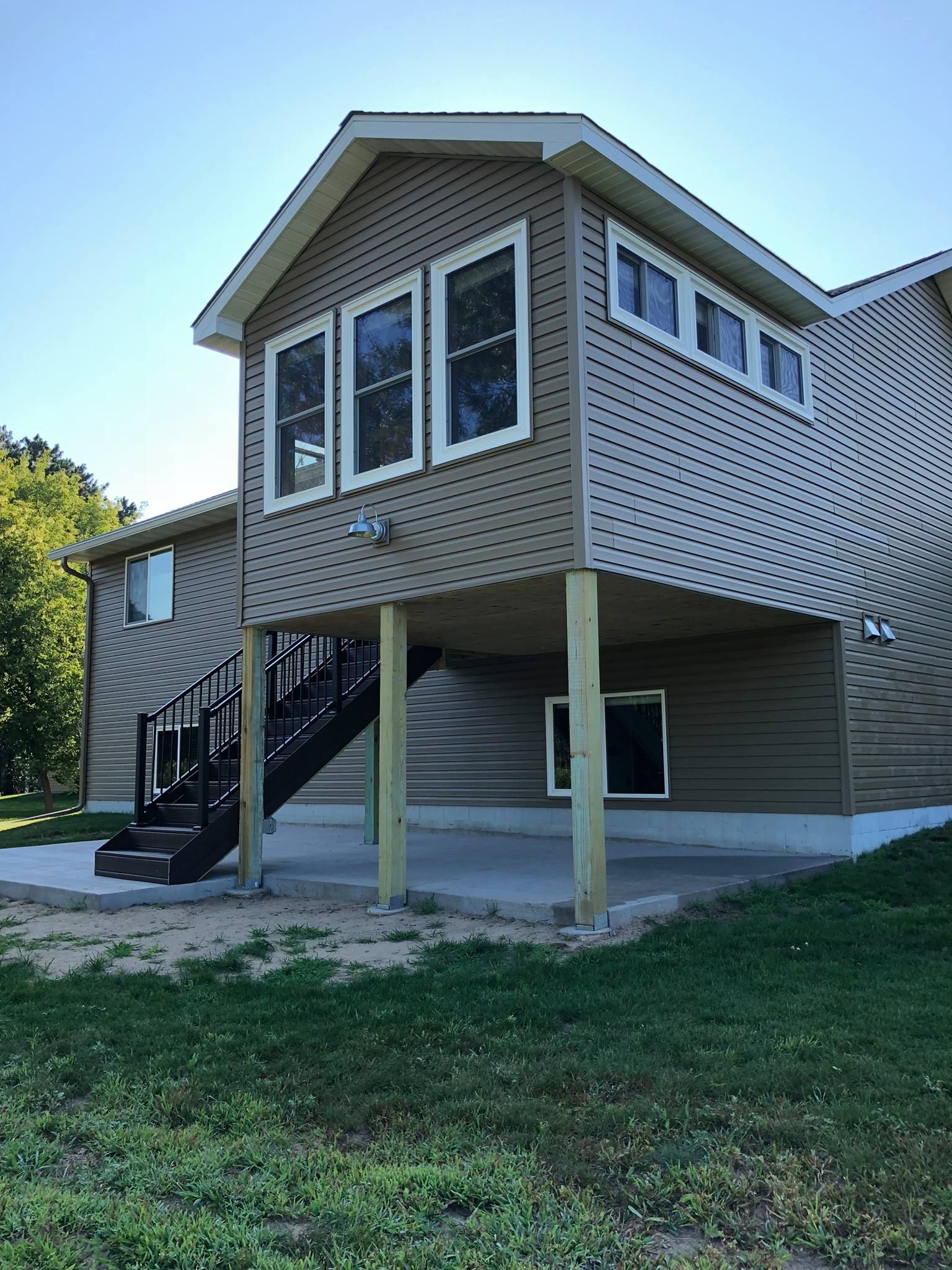 A house with a staircase leading up to the second floor.