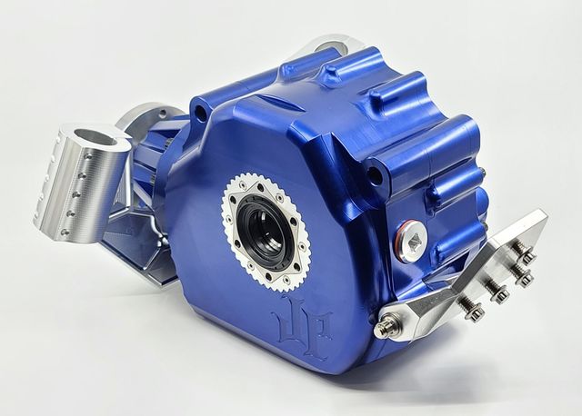 Blue mechanical device with gears and a silver lever on a white background