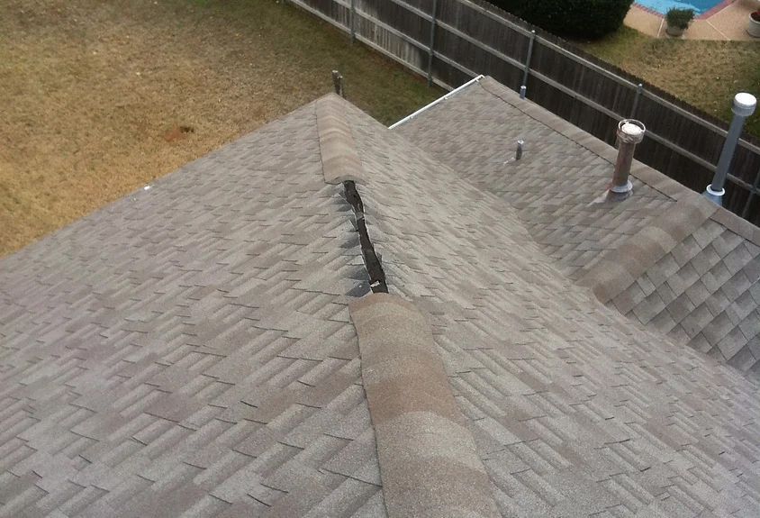 Wind Damaged Ridge Shingles