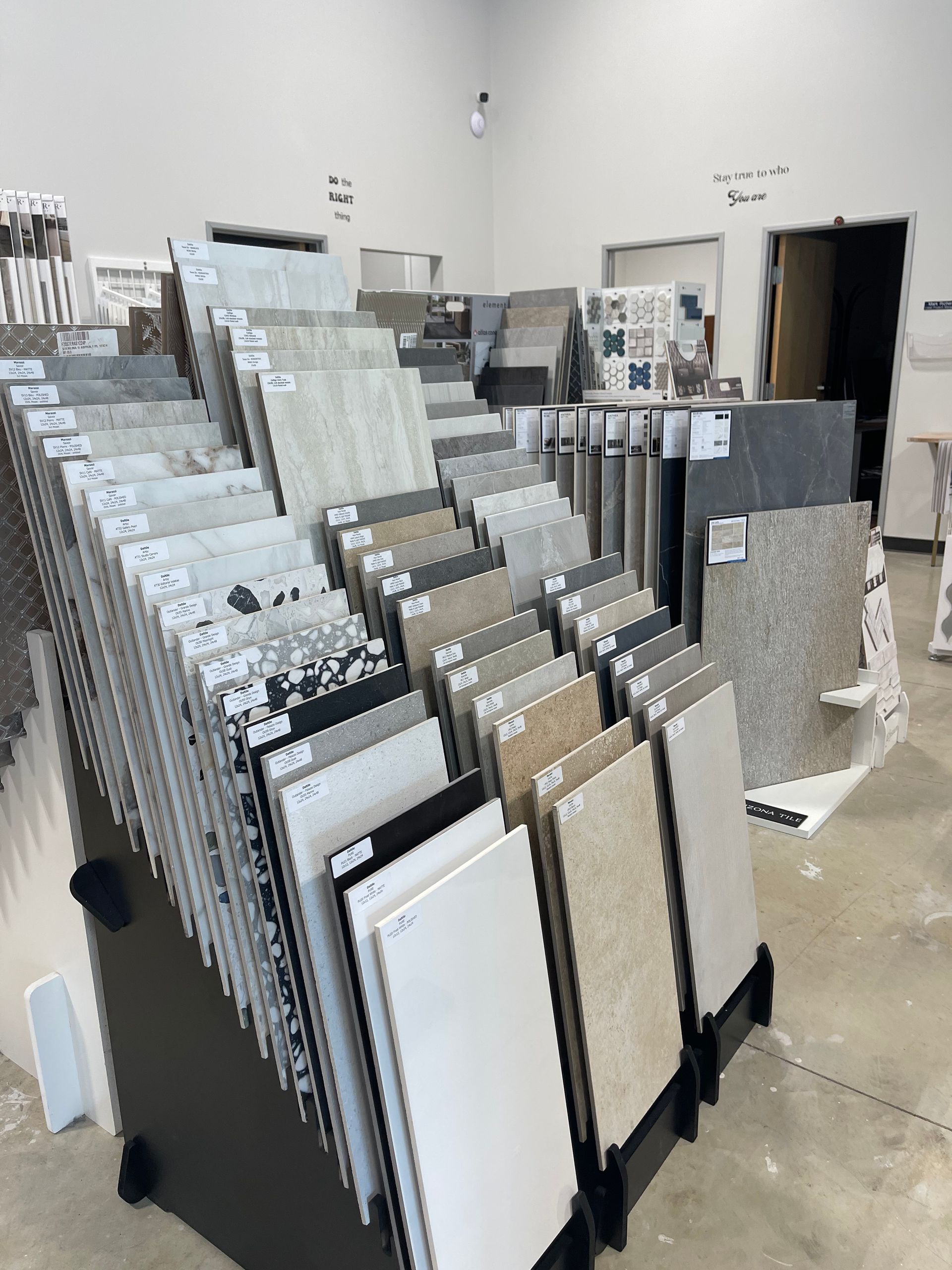 There are many different types of tiles on display in this store.