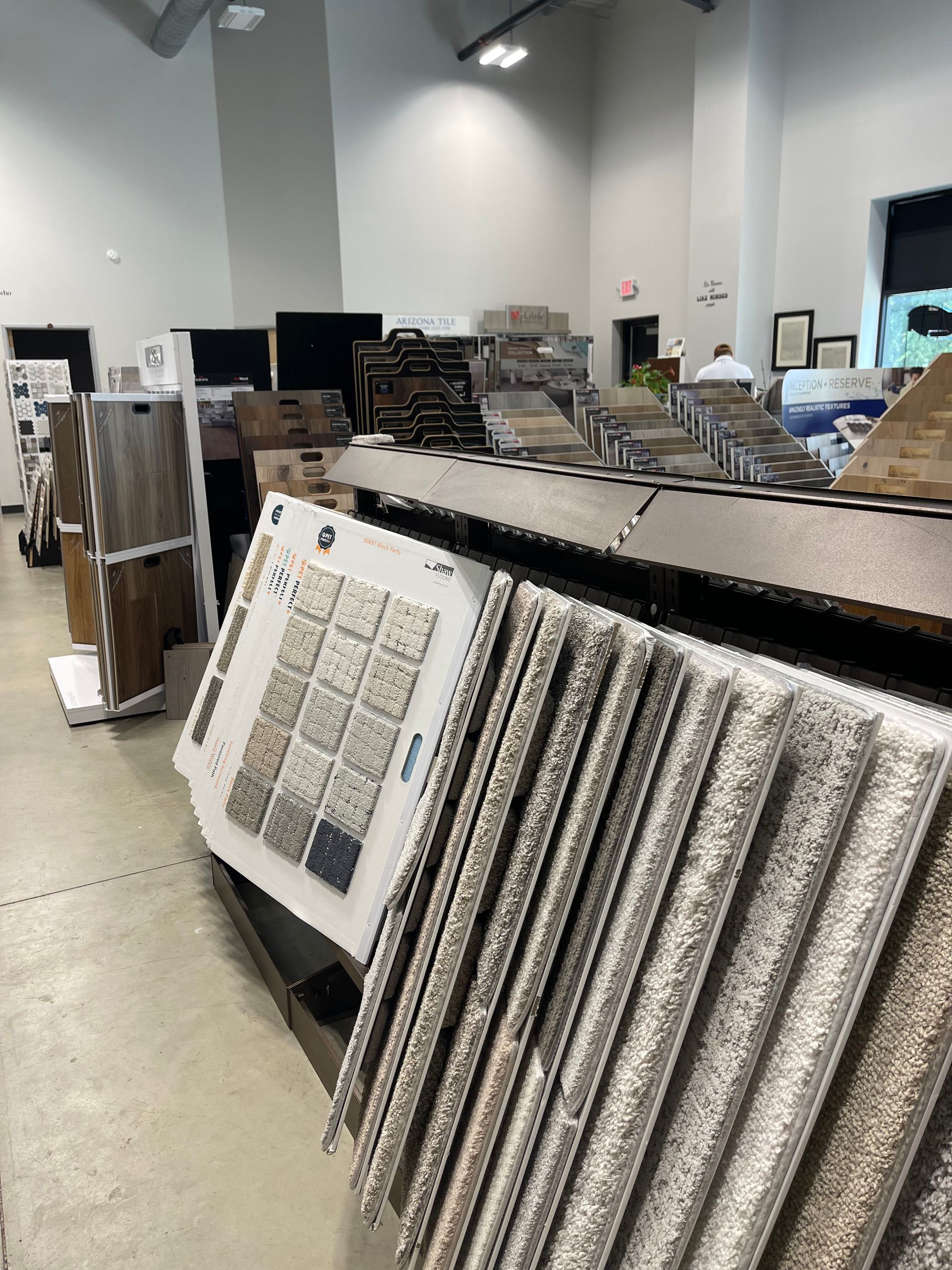 A showroom filled with lots of carpets and tiles