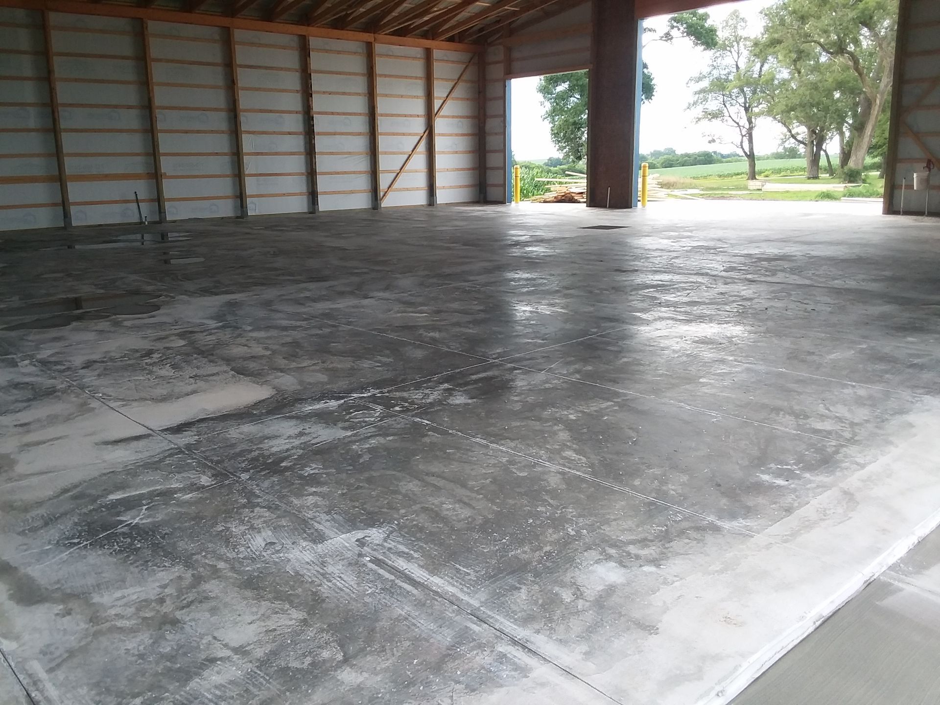 The inside of a building with a concrete floor