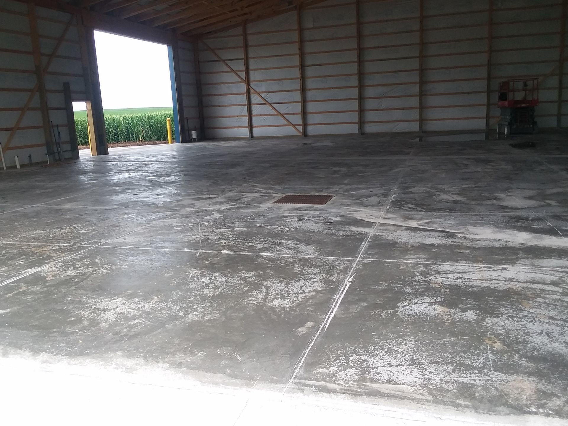 The inside of a building with a concrete floor